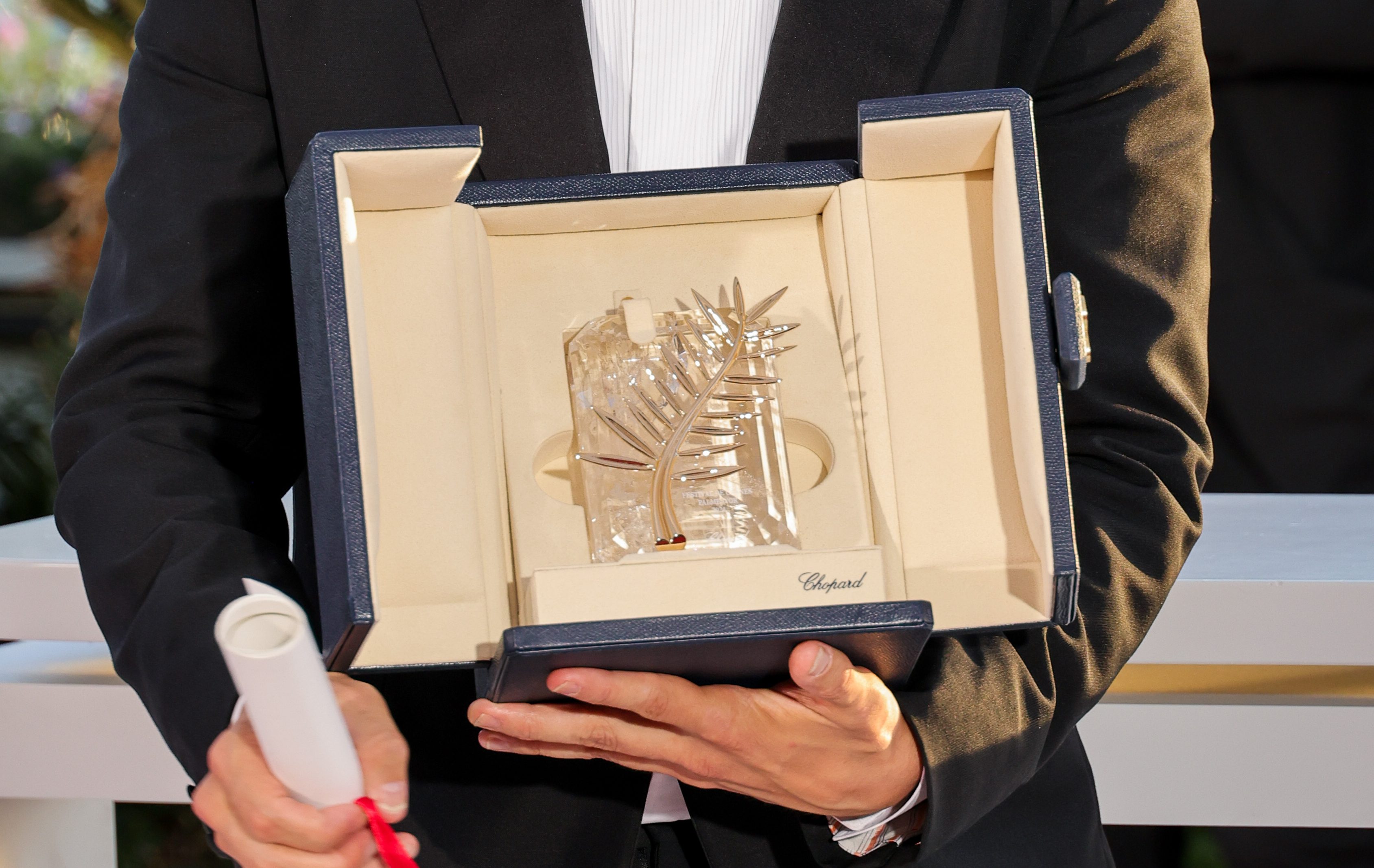 Sean Baker poses with the 'Palme D'Or' Award for 'Anora' during the Palme D'Or Winners Photocall at the 77th annual Cannes Film Festival.