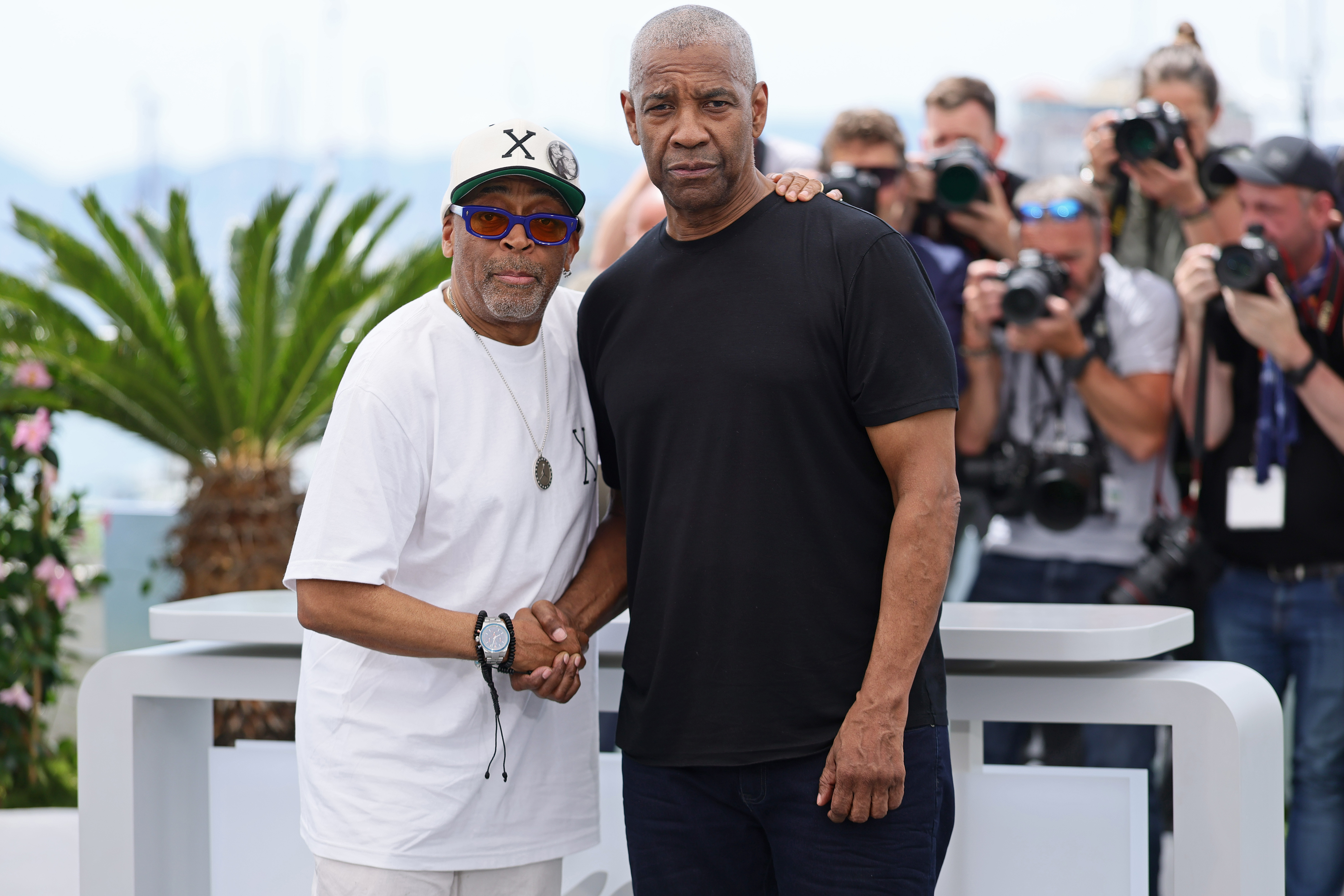 Spike Lee and Denzel Washington pose during the 'Highest 2 Lowest"' photocall at the 78th annual Cannes Film Festival