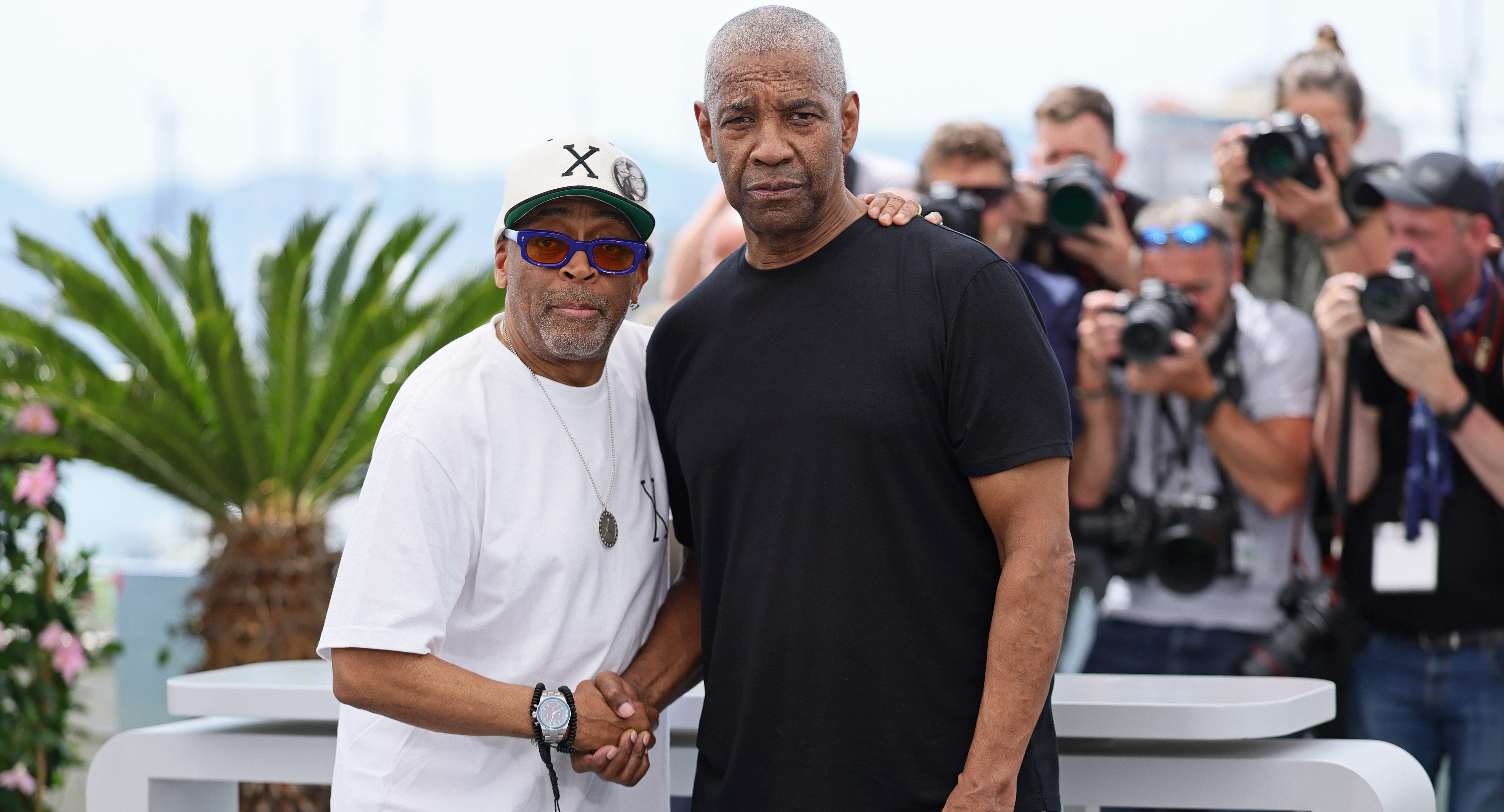Spike Lee and Denzel Washington pose during the 'Highest 2 Lowest' photocall at the 78th annual Cannes Film Festival