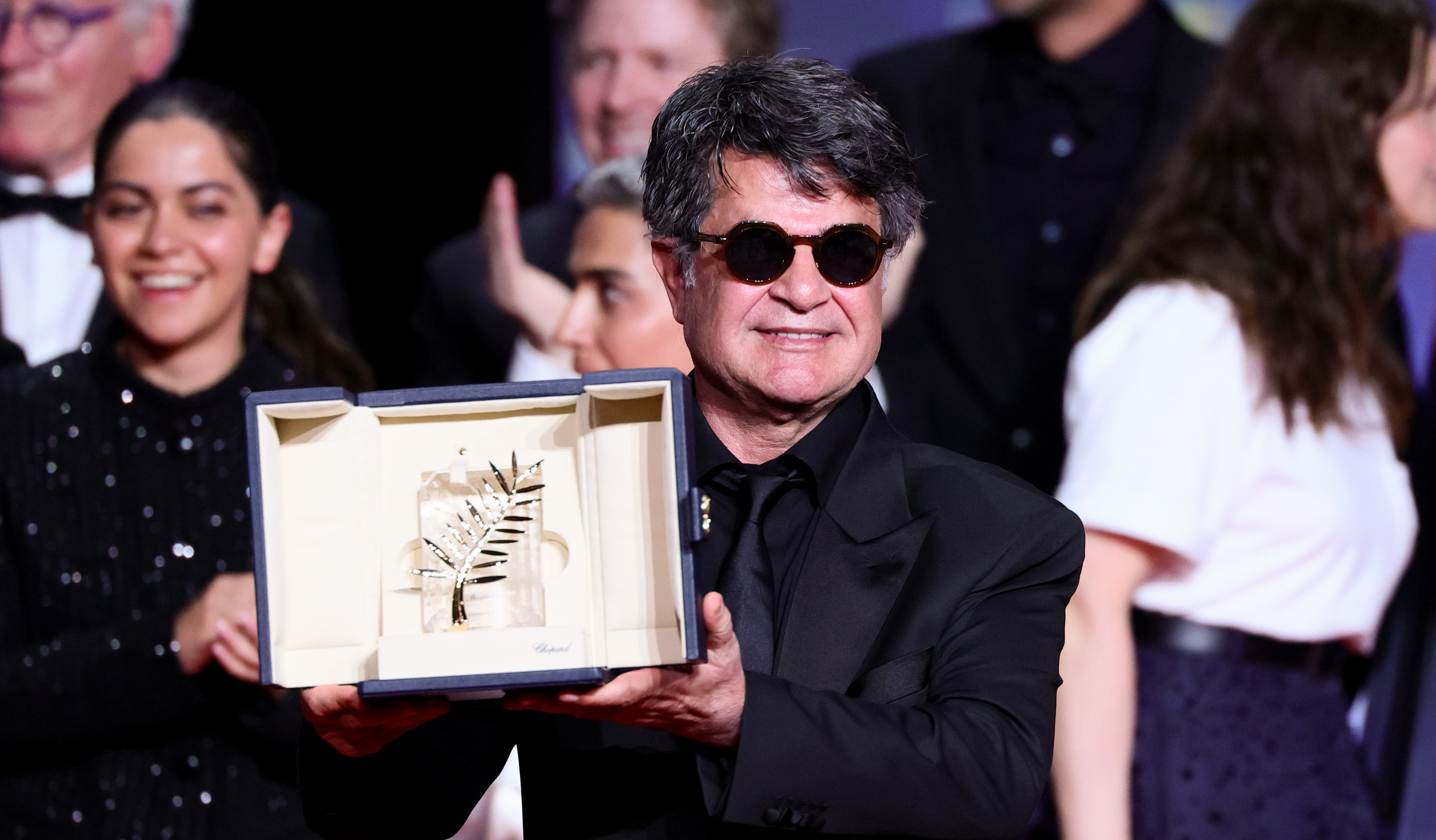 Jafar Panahi accepts the Palme d’Or Award for 'It Was Just an Accident' onstage during the closing ceremony at the 78th annual Cannes Film Festival.