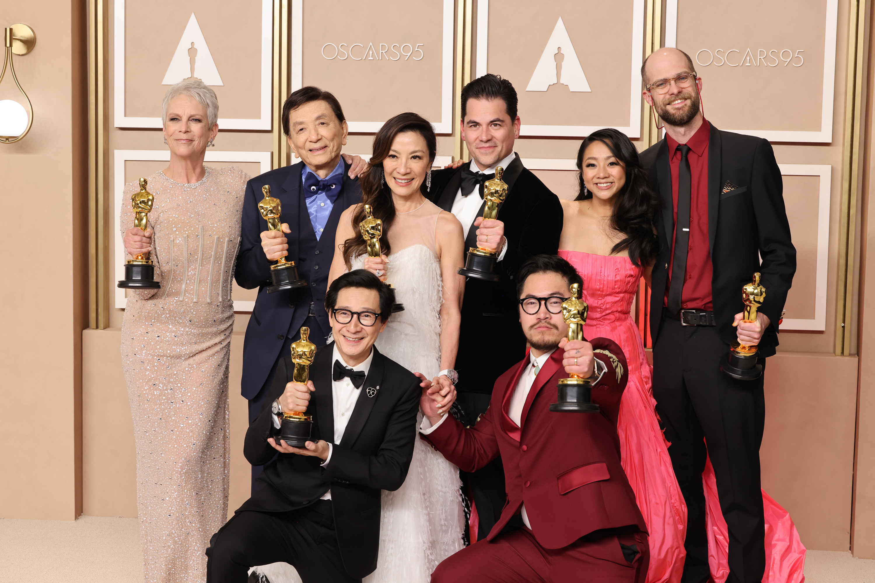 Jamie Lee Curtis, James Hong, Ke Huy Quan, Michelle Yeoh, Jonathan Wang, Daniel Kwan, Stephanie Hsu, and Daniel Scheinert, winners of the Best Picture award for ’Everything Everywhere All at Once’ pose in the press room during the 95th Annual Academy Awards.