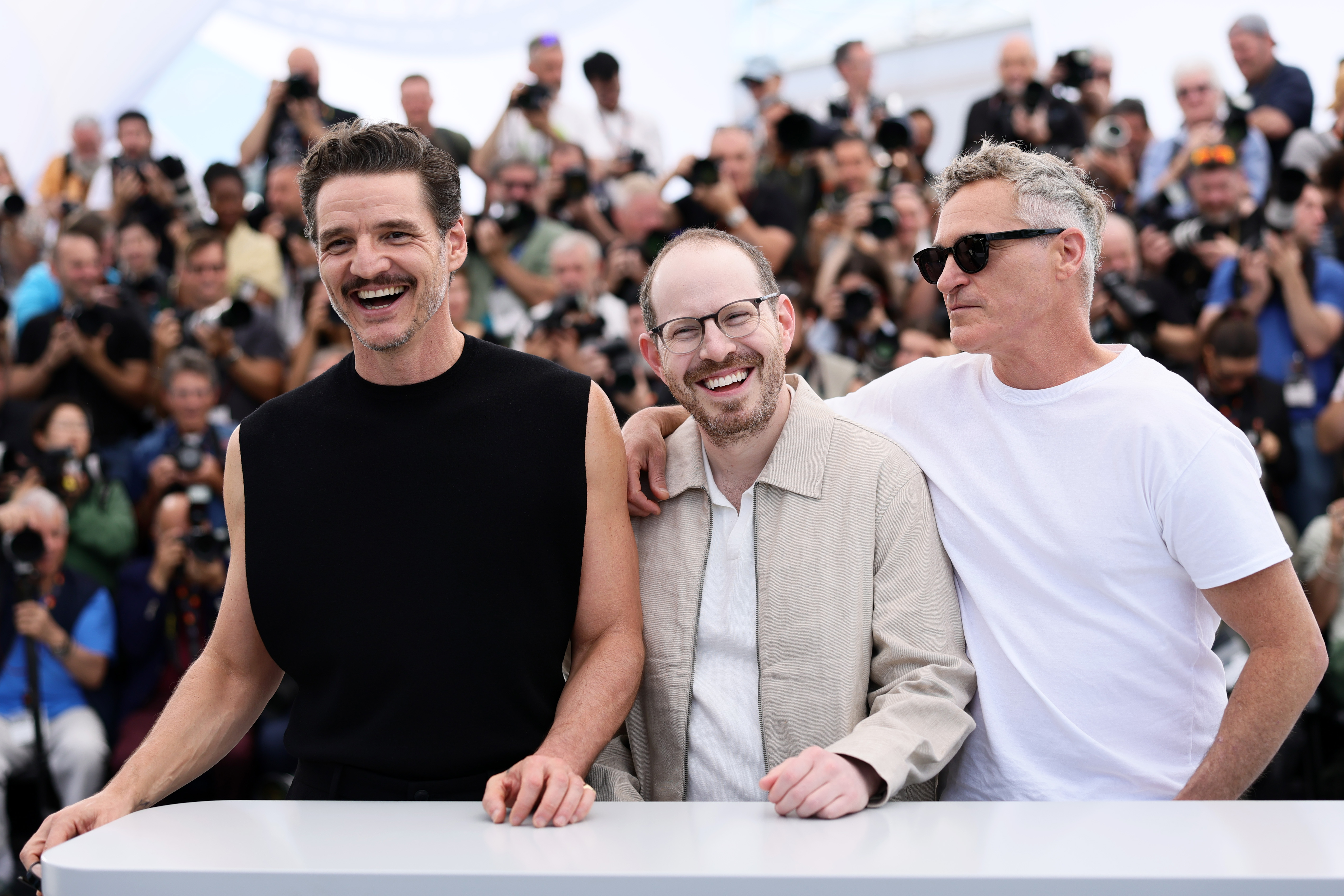 Pedro Pascal, Ari Aster and Joaquin Phoenix pose during the 'Eddington' photocall at the 78th annual Cannes Film Festival