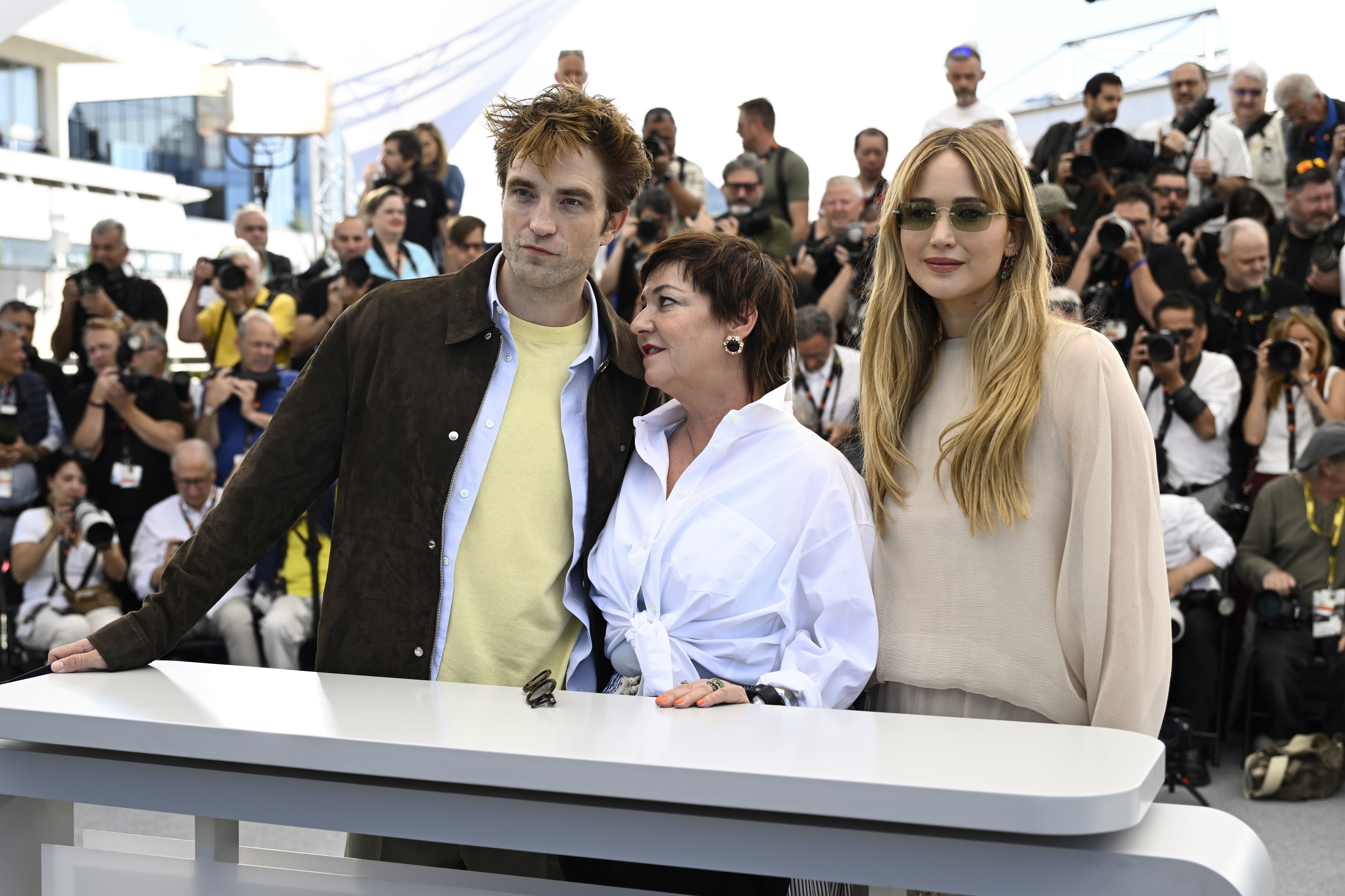 Robert Pattinson, Lynne Ramsay, and Jennifer Lawrence during the 'Die My Love' photocall at the 2025 Cannes Film Festival
