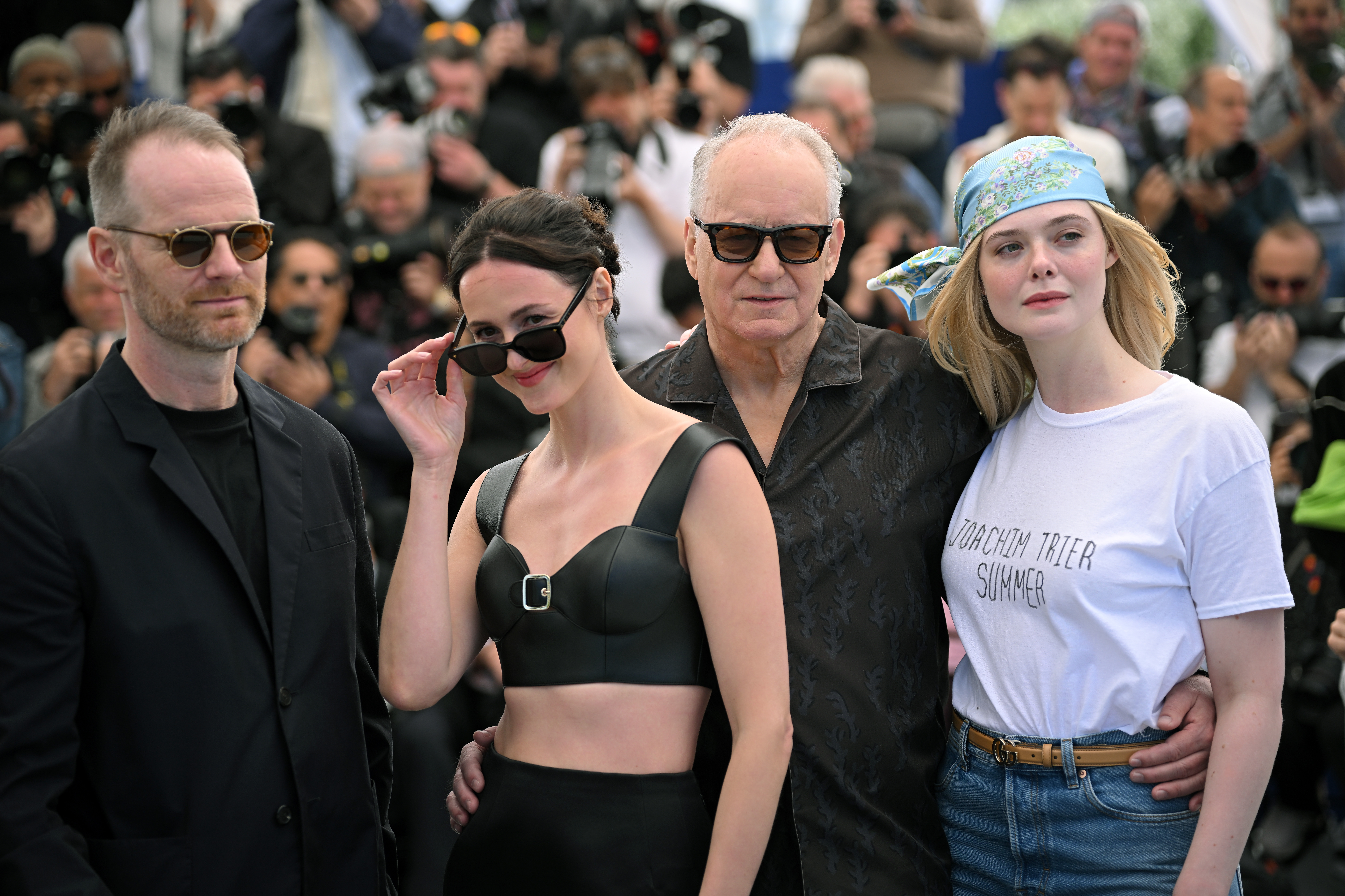 Joachim Trier, Renate Reinsve, Stellan Skarsgård, and Elle Fanning pose during the 'Sentimental Value' photocall