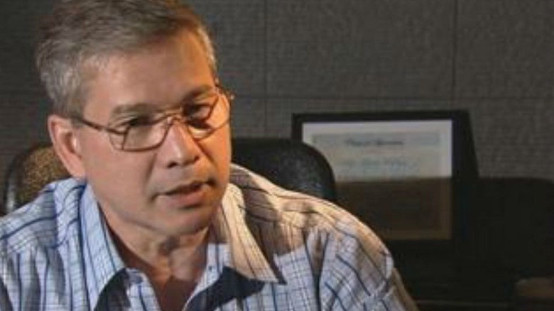 Dennis Roldan speaks while wearing glasses
