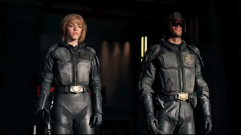 Cassandra and Judge Dredd standing in Dredd (2012)