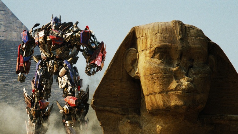 Optimus Prime walking next to the Sphinx