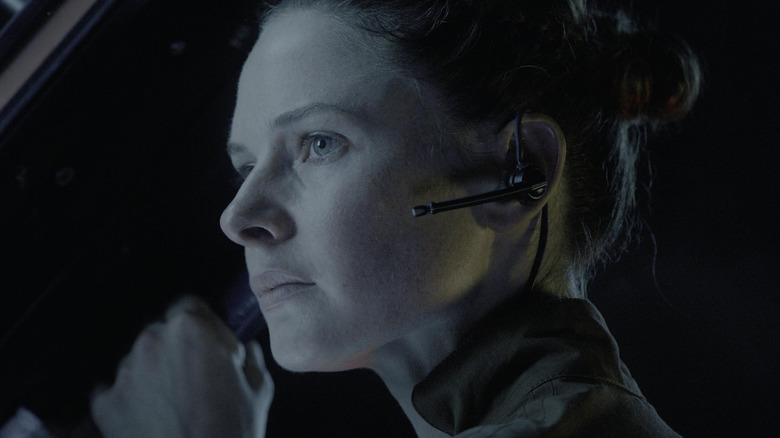 Dr. Miranda North peering into space in Life