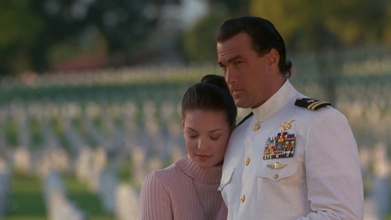 Casey and Sarah hugging at cemetary in Under Siege 2: Dark Territory (1995)