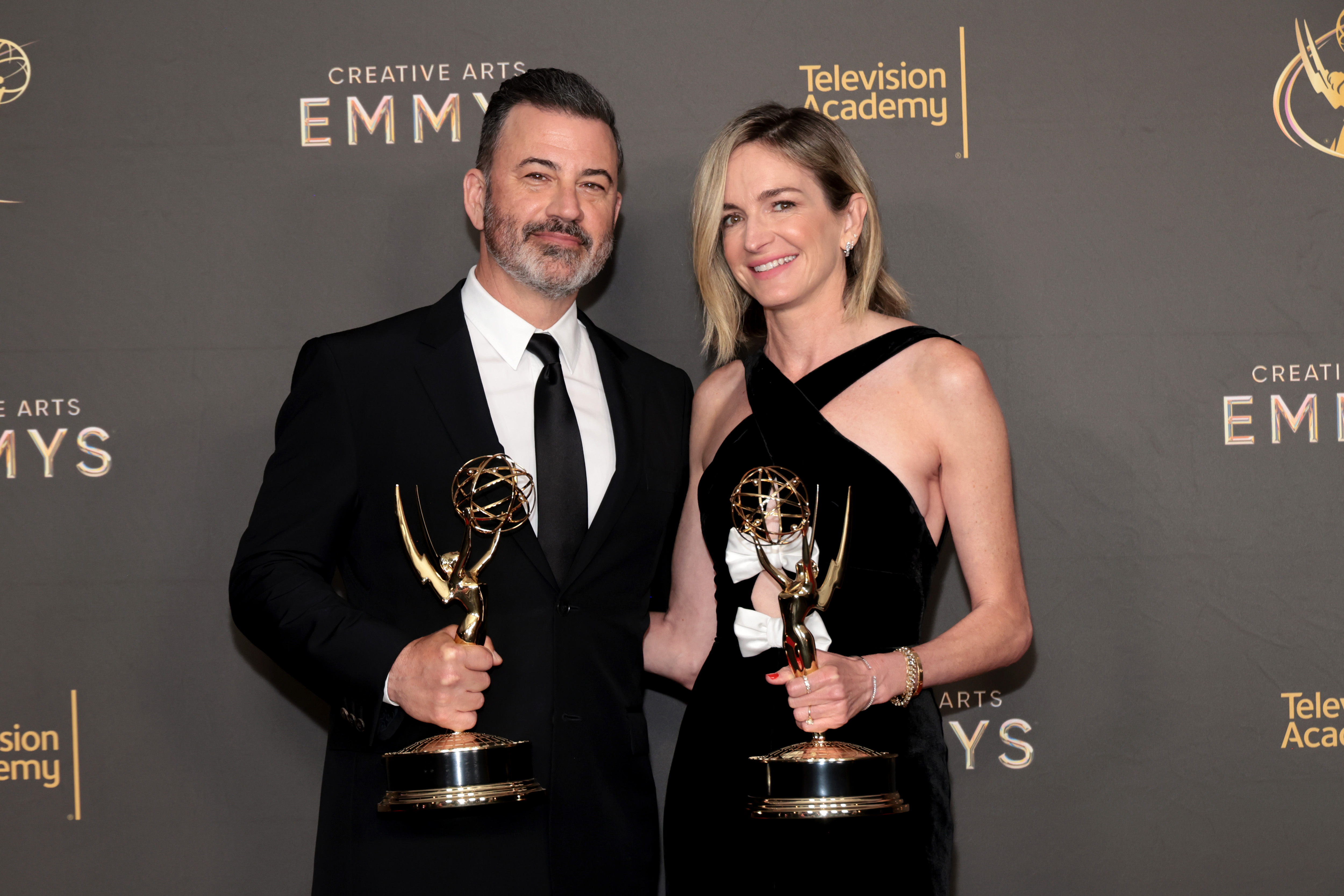 Jimmy Kimmel and Molly McNearney, winners of the Emmy Award for Outstanding Writing - Variety Special for 'The Oscars', attend the 76th Creative Arts Emmys Winner's Walk at Peacock Theater.