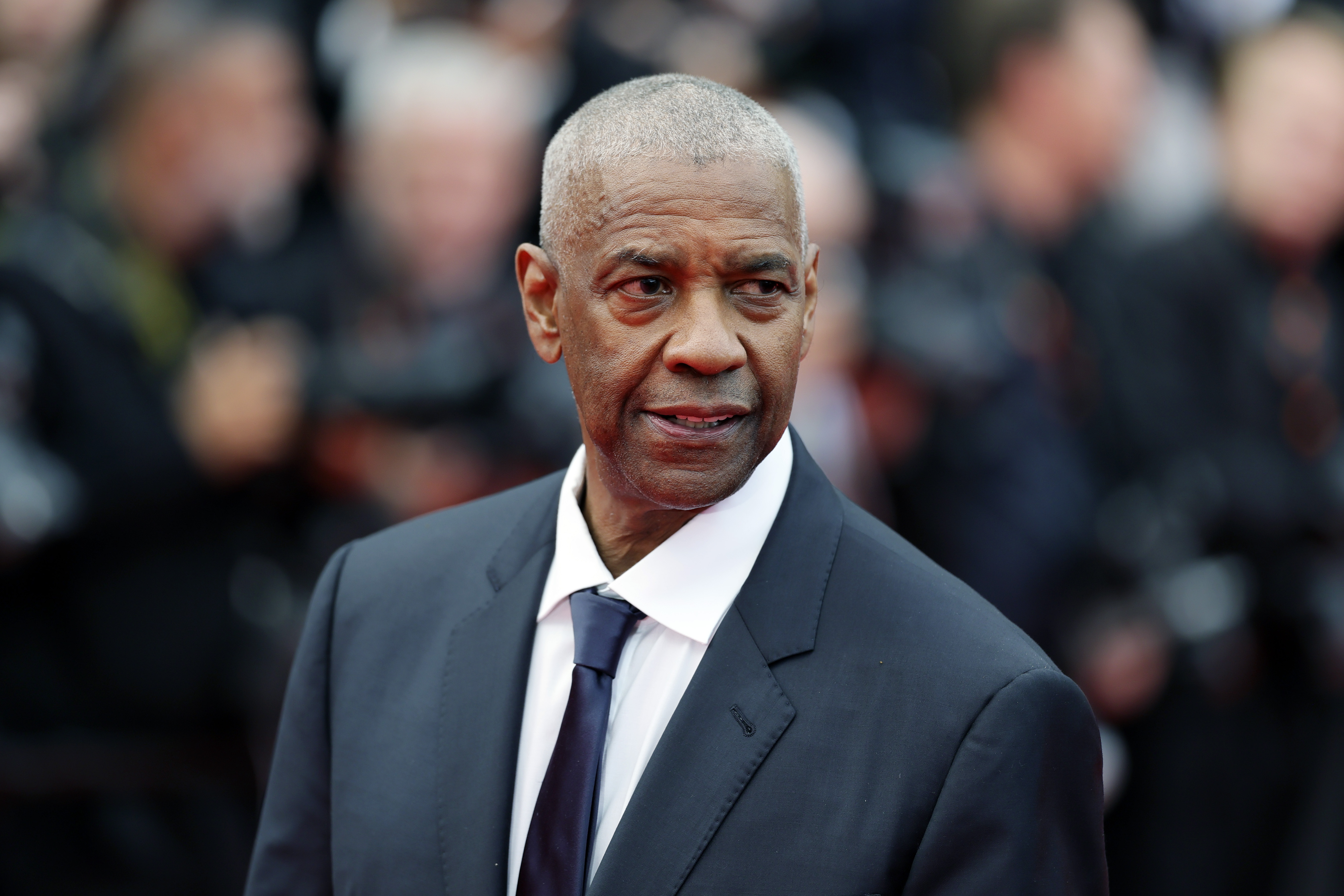 Denzel Washington attends the 'Highest 2 Lowest' red carpet at the 78th annual Cannes Film Festival