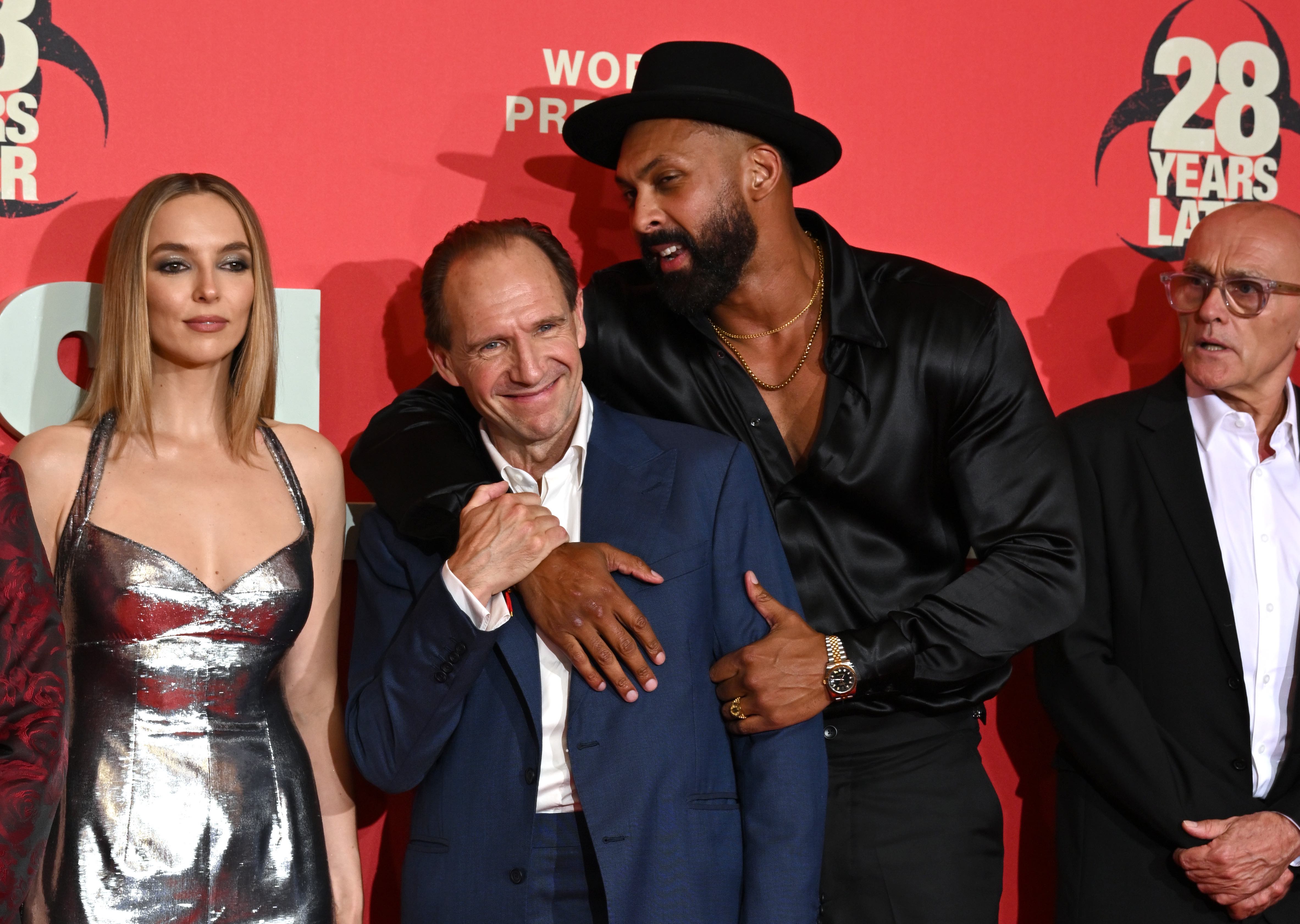 LONDON, ENGLAND - JUNE 18: (L-R) Jodie Comer and Ralph Fiennes and Chi Lewis-Parry attend the "28 Years Later" World Premiere at the Odeon Luxe Leicester Square on June 18, 2025 in London, England. (Photo by Jeff Spicer/Getty Images)