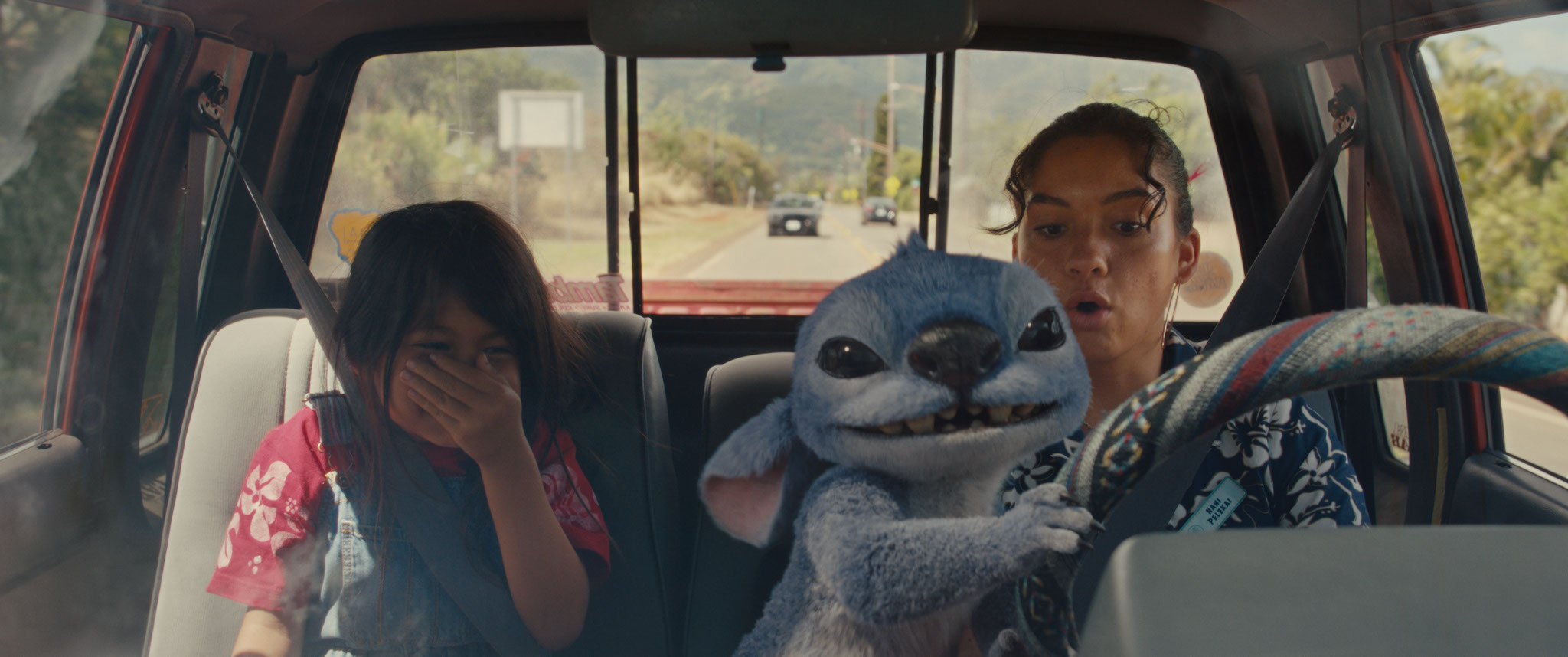 (L-R) Maia Kealoha as Lilo, Stitch and Sydney Agudong as Nani in Disney’s live-action LILO & STITCH. Photo courtesy of Disney. © 2025 Disney Enterprises Inc. All Rights Reserved.