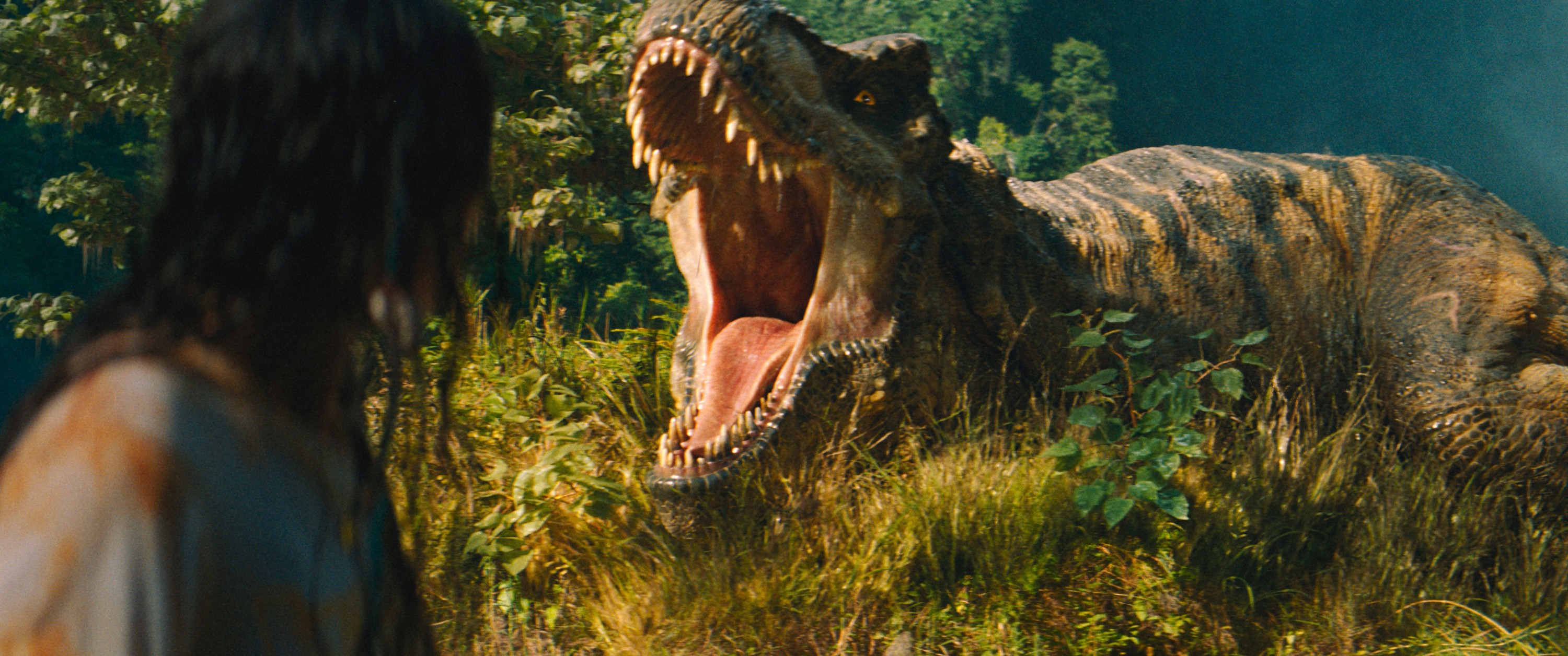 JURASSIC WORLD: REBIRTH, (aka JURASSIC WORLD REBIRTH, aka JURASSIC WORLD 4), from left: Luna Blaise, a T-Rex, 2025. © Universal Pictures /Courtesy Everett Collection