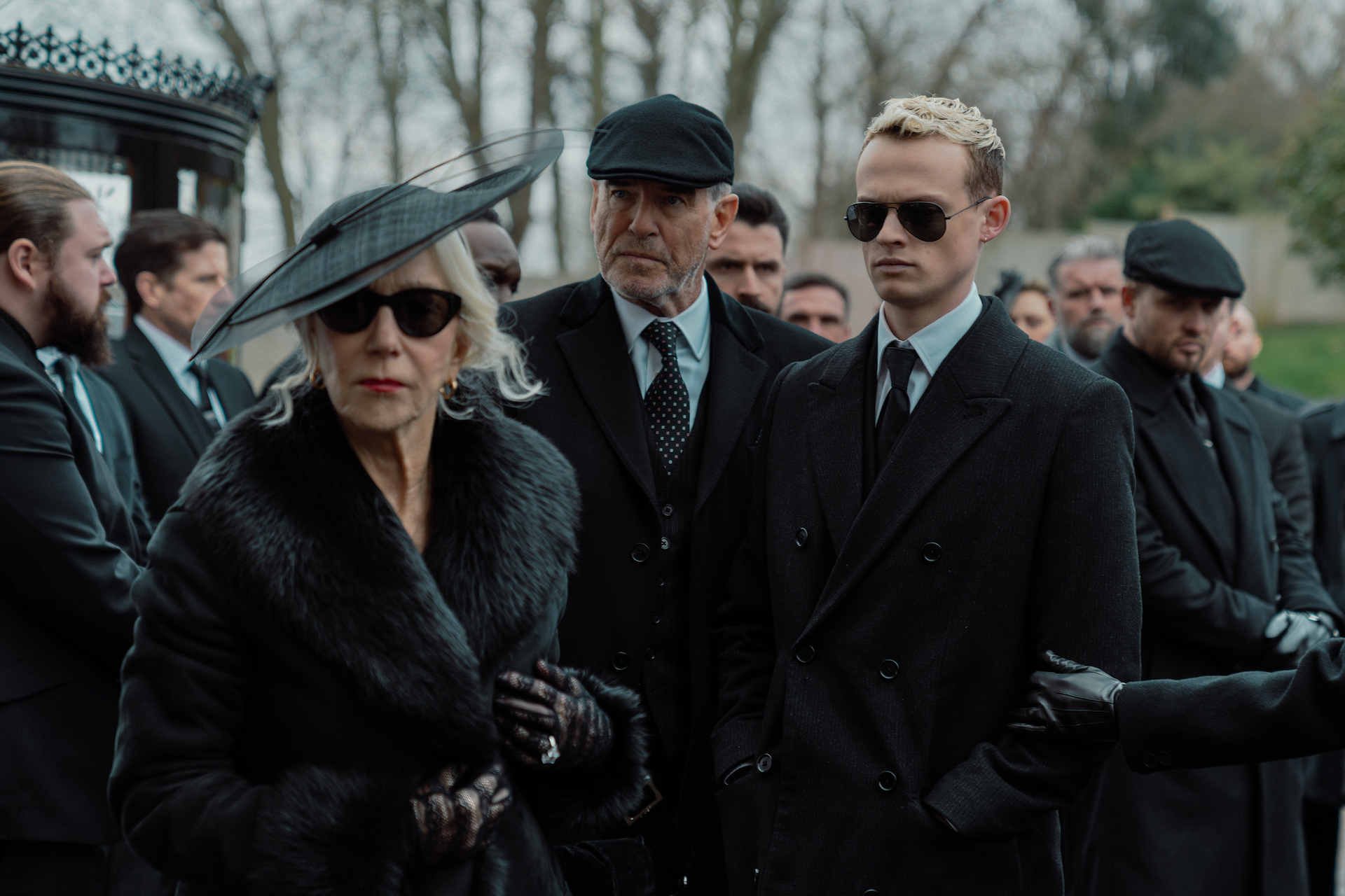 L-R Helen Mirren as Maeve Harrigan , Pierce Brosnan as Conrad Harrigan and Anson Boon as Eddie Harrigan in Mobland, episode 5, season 1, Streaming on Paramount+ 2025. Photo Credit: Luke Varley/Paramount+
