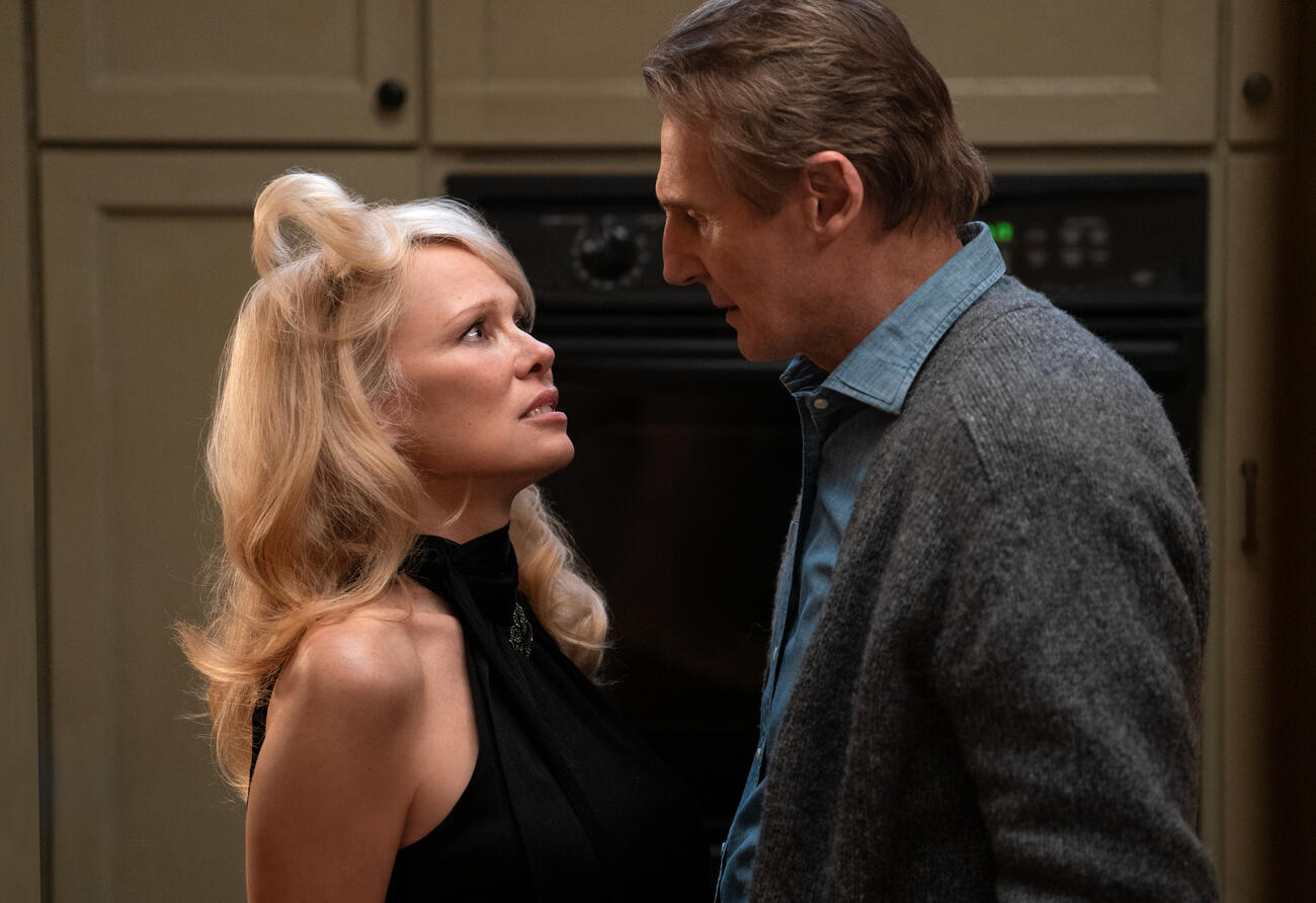 Pamela Anderson plays Beth and Liam Neeson plays Frank in The Naked Gun from Paramount Pictures.