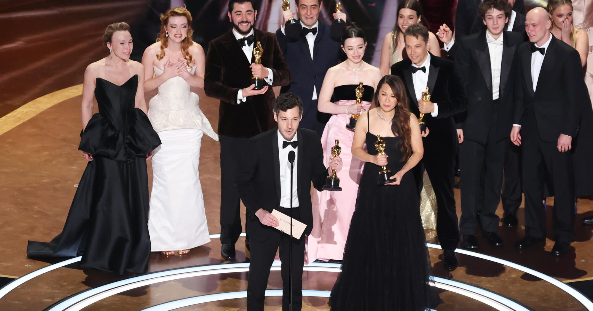 Alex Coco, Mikey Madison, Sean Baker and the cast of "Anora" at the 97th Oscars held at the Dolby Theatre on March 2, 2025 in Hollywood, California.