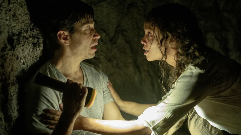 Tess consoles a distraught AJ in a dark tunnel in "Barbarian" (2022)