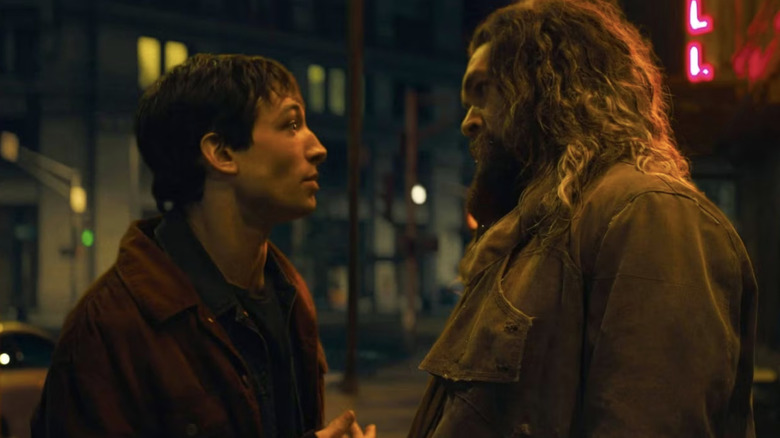 Barry Allen and Arthur Curry talk in an alley in "The Flash" (2023)