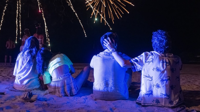 Teens at the full moon party in "The White Lotus"