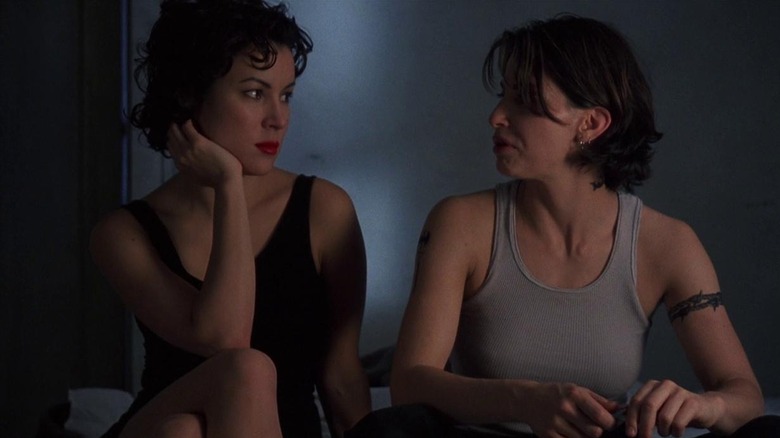 Corky and Violet sit together in "Bound" (1996)