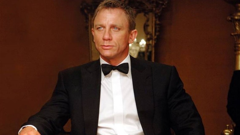 James Bond (Daniel Craig) sitting at the poker table