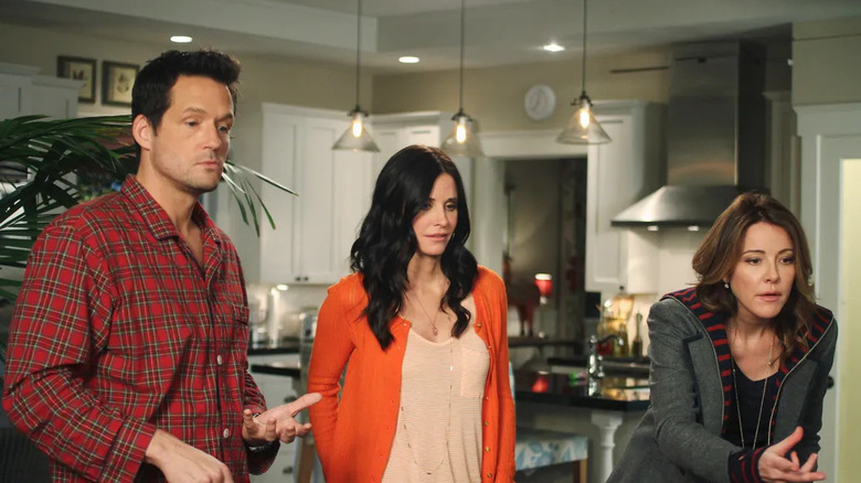 Grayson Jules and Ellie in the kitchen looking baffled on Cougar Town