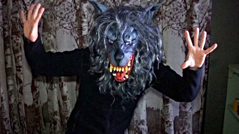 Josef raises his hands while wearing the Peachfuzz wolf mask in "Creep" (2014)