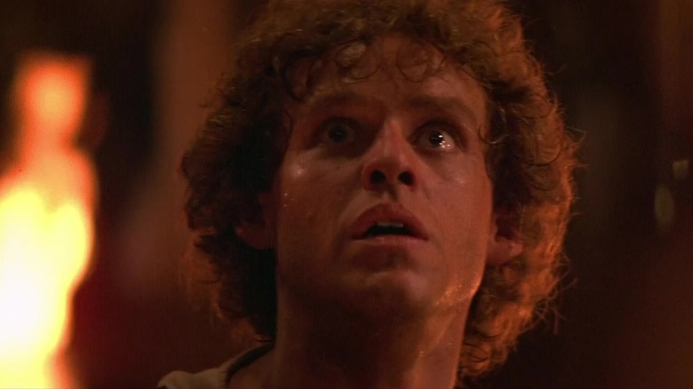 Galen looking terrified in the dragons' lair in Dragonslayer (1981)