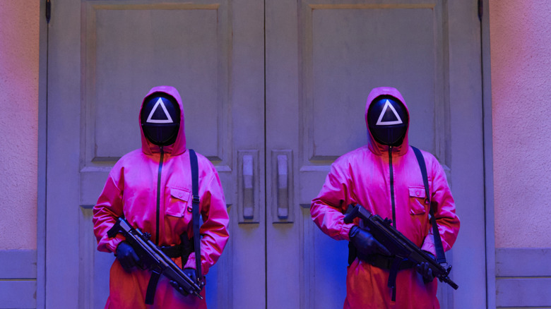 Pink guards at work in "Squid Game" (2021-2025)