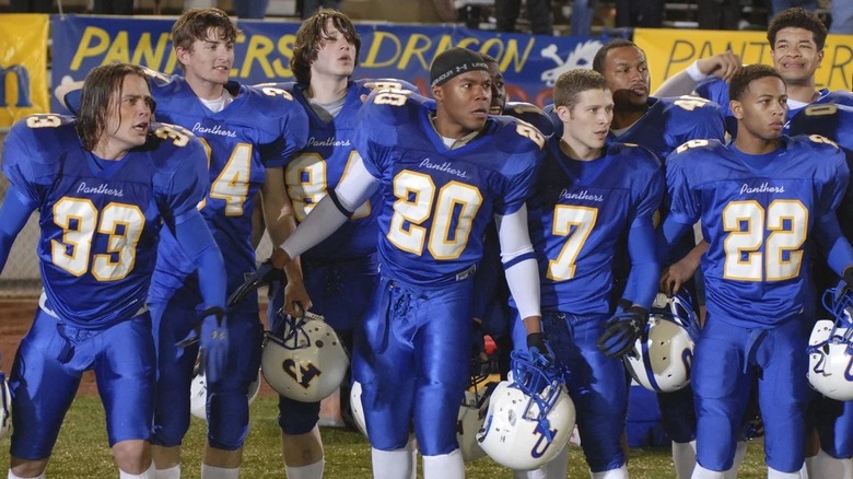 The Dillon Panthers looking on from the side of the football field