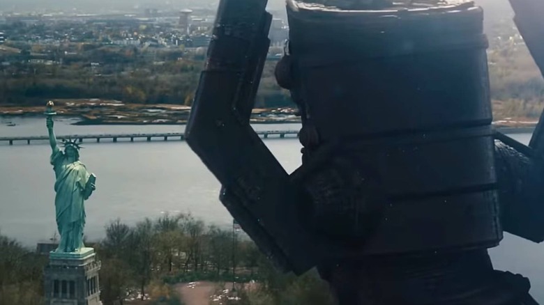 Galactus looking at the Statue of Liberty in The Fantastic Four: First Steps