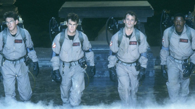 Peter, Ray, Egon, and Winston standing together in "Ghostbusters"