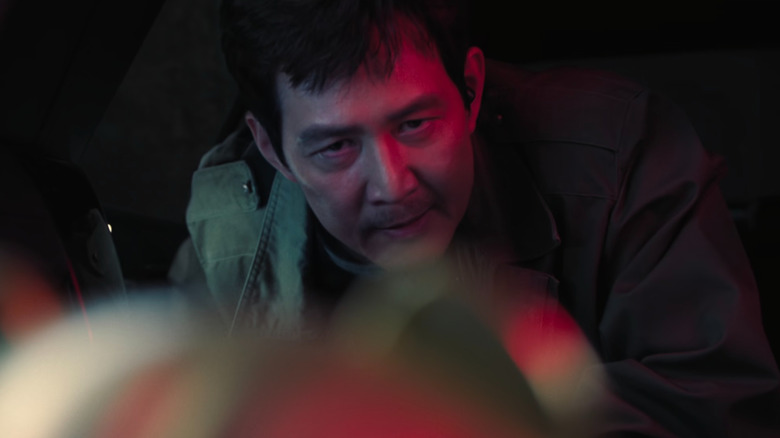 Gi-hun talking into speaker on Squid Game Season 2