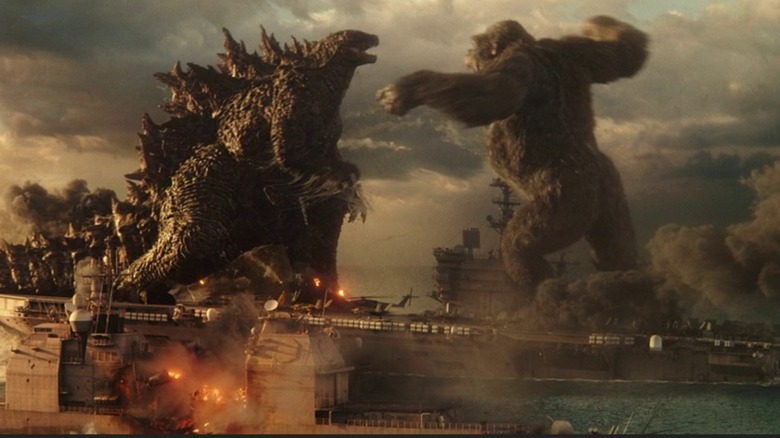Godzilla and Kong fight over a boat in "Godzilla vs. Kong" (2021)