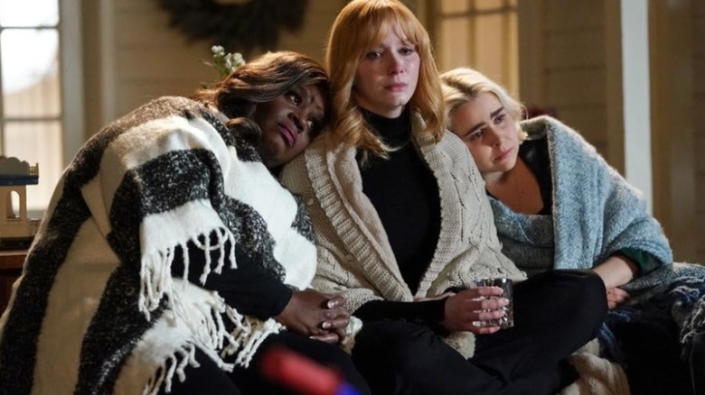 Beth, Annie, and Ruby sitting on a porch in "Good Girls" (2018-2021)