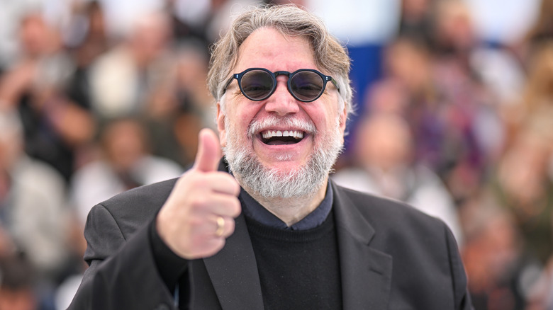 Guillermo del Toro giving a thumbs up at Cannes