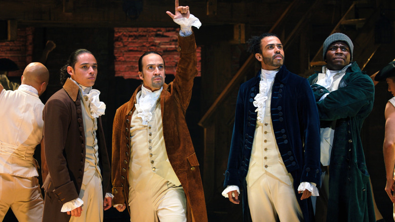 John Laurens, Hamilton, Marquis de Lafayette, and Hercules Mulligan singing in "Hamilton"