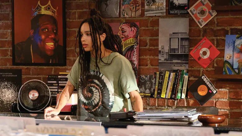 Rob at the desk of the record shop in High Fidelity