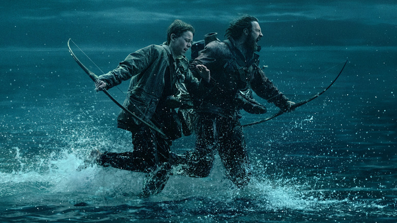 Jamie and Spike flee on the causeway in "28 Years Later" (2025)