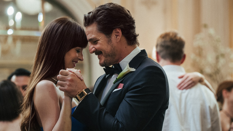 Lucy and Harry dance alongside couples at a wedding in "Materialists" (2025)