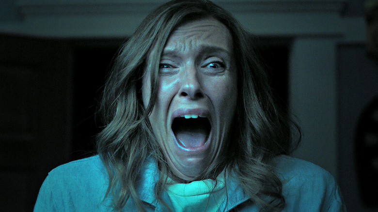 Annie screams in horror in "Hereditary" (2018)