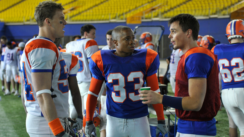 Thad, Craig, and Alex talking on field (2010)