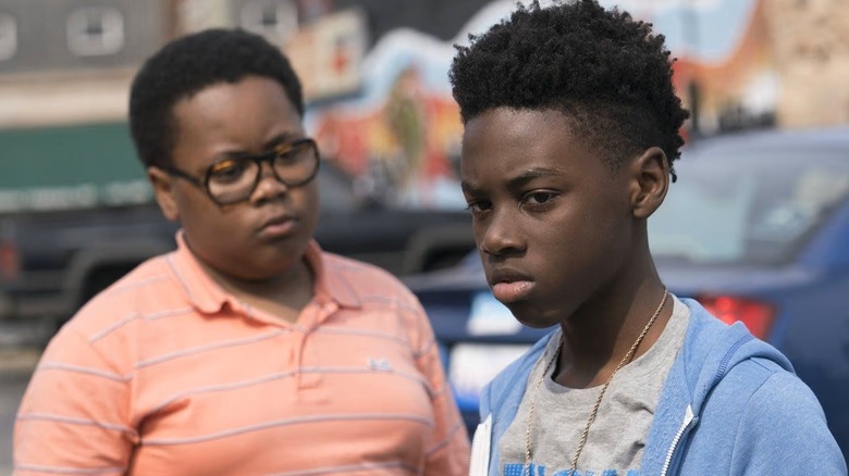 Papa looks at Kevin in a parking lot in "The Chi" (2018-present)