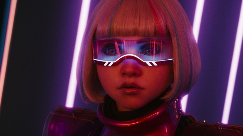 M3GAN wearing a visor and wig by neon lights in "M3GAN 2.0" (2025)