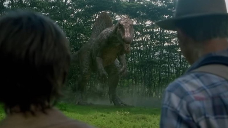 Spinosaurus looking at Dr. Grant and Eric in Jurassic Park III
