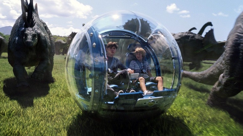 Kids riding a gyrosphere in Jurassic World
