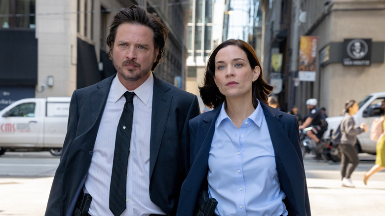 Detectives Bateman and Graff stroll the city streets in "Law & Order: Toronto: ﻿Criminal Intent"