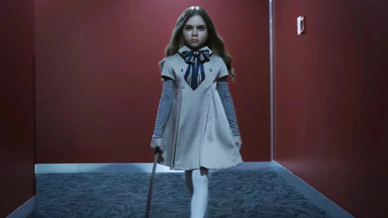 M3GAN walking with a sword in "M3GAN" (2023)