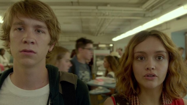 Greg (Thomas Mann) and Rachel (Olivia Cooke) talking and staring at something off-camera